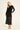 Claudine Dress fra A-View – elegant sort meshkjole med fløyelsblomster, midi-lengde og sidesplitt. Tilgjengelig i S–L.
