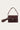 Adele Bag Real Suede Plum fra Noella er en skulderveske i 100 % semsket skinn med klafflukking, dekorativ metalldetalj og strukturert design i en dyp plommefarge.