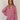 Stripete strikket polo fra Boii i Pink/Bordeaux, laget i 100 % bomull med polokrage, lange ermer og oversized passform i One Size. Modellen er 174 cm høy.