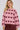 Heart Knit Pullover fra A-View med hjertemønster i bordeaux og rosa, vist på modell forfra mot hvit bakgrunn.