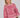 Alt-tekst: Modell med Luxana Knit Pullover Rose/Pink fra A-View – rosa mønstret strikkegenser med rund hals og lange ermer.