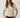 Modell forfra med N-Marthy Knit Ivory Brown fra Noella – lys strikkegenser med brune kontrastdetaljer og brystlomme.