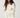 Modell forfra med N-Maidie Knit Offwhite fra Noella – offwhite strikkegenser med rund hals, lange ermer og avslappet passform.