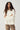 Modell forfra med N-Maidie Knit Offwhite fra Noella – offwhite strikkegenser med rund hals, lange ermer og avslappet passform.
