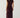 Modell sett bakfra i Noella N-Mignonette Dress Fig med draperte samlinger midt bak og myk velouroverflate.