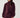 Modell med Noella N-Melda Dress Maroon, en dyp vinrød minikjole med høy hals, lange voluminøse ermer, markert midje og lett utsvingt skjørt.