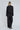 Modell med A-View Napoleon Blazer Black – klassisk sort blazer med dekorative knapper foran og på ermene. Vist bakfra
