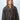 Modell med Big Triangle Scarf Brown fra Sui Ava – stort brunt trekantskjerf i myk strikk stylet rundt halsen.