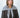 Modell med Big Triangle Scarf Grey fra Sui Ava – stort grått trekantskjerf i myk strikk stylet rundt halsen.