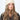 Modell med Jen Harka Hat Beige fra Sui Ava – beige hatt i semsket lammeskinn stylet til høst- og vinterantrekk.