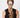 SUI AVA Cringle Ribbon Scrunchie Light Blue, lyseblå scrunchie med dekorativ, rynket struktur, brukt som hårtilbehør på modell.