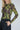 Modell fra siden med A-View Silke Blouse Lime – figurnær meshbluse med lange ermer, stretch og dekorativt blomsterprint.