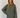 Stripete strikket polo fra Boii i Olive/Blue, laget i 100 % bomull med polokrage, lange ermer og oversized passform i One Size. Modellen er 174 cm høy.