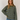 Stripete strikket polo fra Boii i Olive/Blue, laget i 100 % bomull med polokrage, lange ermer og oversized passform i One Size. Modellen er 174 cm høy.