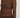 Modell med A-View Evalla Blouse Dark Brown – mørkebrun figurnær blondetopp med rund hals, lange ermer og transparent blondemønster.