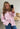 Modell med BOII Fie Shirt Lolly Stripe – fargerik stripete oversized skjorte i 100 % bomull med skjortekrage, knapper foran og brede ermer.
