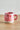 Millie Espresso Cup Pink Strawberry 110 ml fra Bloomingville – rosa espressokopp med håndmalte røde jordbær og grønne blader.