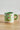 Millie Espresso Cup Green Mushroom fra Bloomingville MINI – grønn espressokopp i steintøy med røde og hvite sopper, 110 ml.