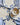 Eimy Plate Blue fra Creative Collection by Bloomingville – ulike håndmalte blå blomstermotiver stylet sammen på bord.