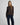 Modell med MSCHAgatha East Pullover Dark Brown fra MSCH Copenhagen – mørkebrun finstrikket genser med rund hals og lange ermer.