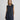 Modell med MSCHBondie Hope Vest fra MSCH Copenhagen – svartmelert strikkevest med rund hals og knappelukking foran.