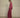 Shaelan Wide Pants Red fra MSCH Copenhagen – rød bukse med vide ben og lett glans, sett fra siden.