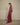 Shaelan Wide Pants Red fra MSCH Copenhagen – rød bukse med vide ben og lett glans, sett fra siden.