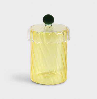 Krukke fra &Klevering i gul med glasslokk og svart håndtak.
